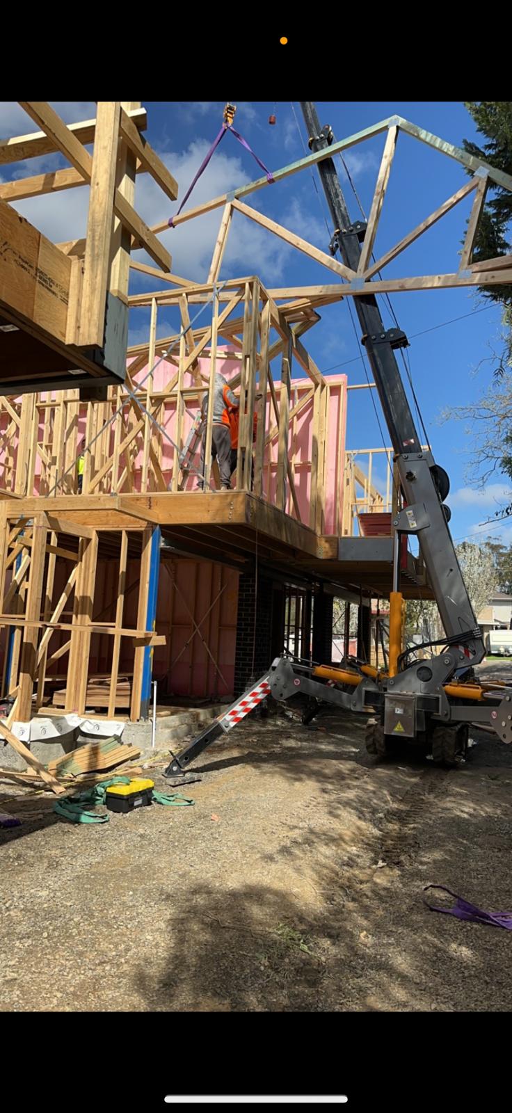 Spider crane at backyard framing job